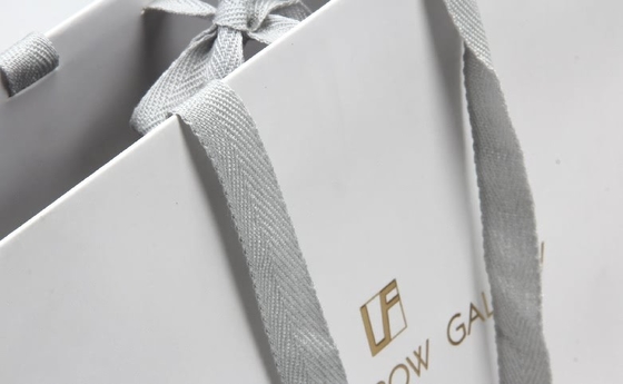 Bolsas de papel personalizadas blancas Gafas de gama alta Bolsas de papel para compras