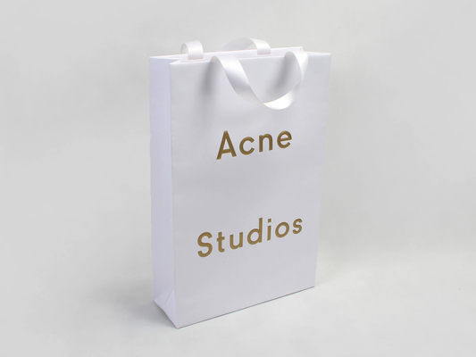 Bolsas de compras de ropa de papel teñido de lujo Bolsa de papel con estampado de letras