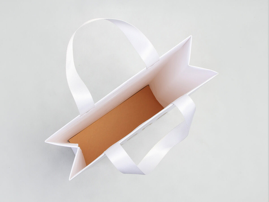 Bolsas de compras de ropa de papel teñido de lujo Bolsa de papel con estampado de letras
