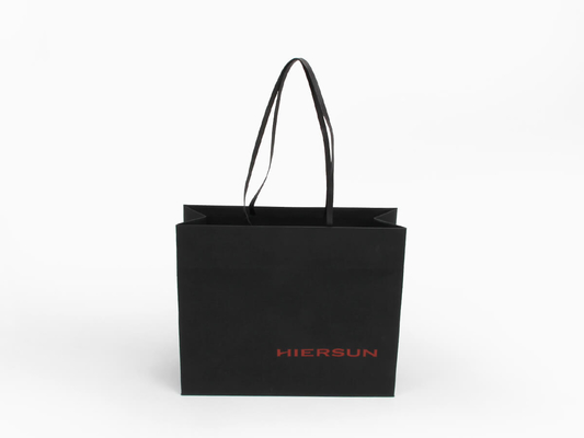 Bolsos de compras de papel premium OEM Bolsos de compras de ropa de tacto suave