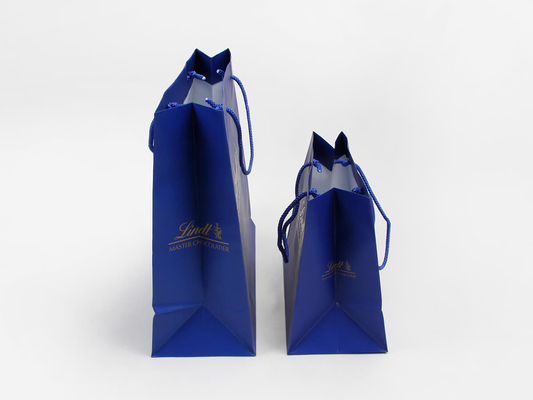 C1S C2S Bolsas de papel personalizadas recubiertas brillantes Bolsas de papel para compras de ropa azul marino