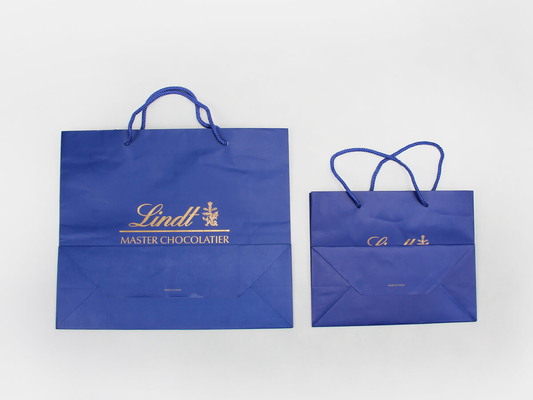 C1S C2S Bolsas de papel personalizadas recubiertas brillantes Bolsas de papel para compras de ropa azul marino