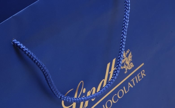 C1S C2S Bolsas de papel personalizadas recubiertas brillantes Bolsas de papel para compras de ropa azul marino